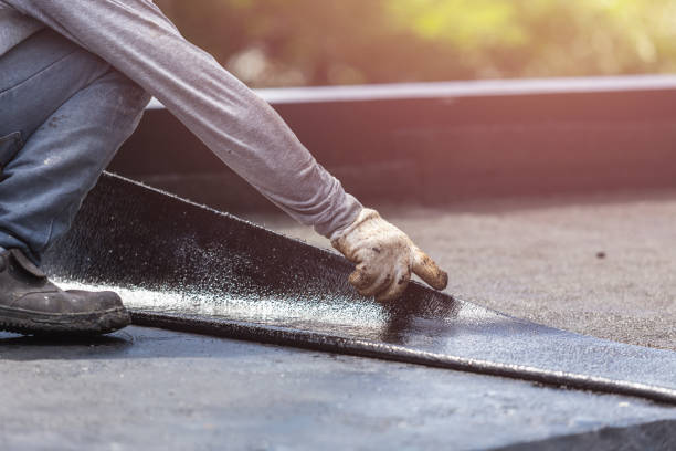 Professional Waterproofing technician working in Elwell, MI